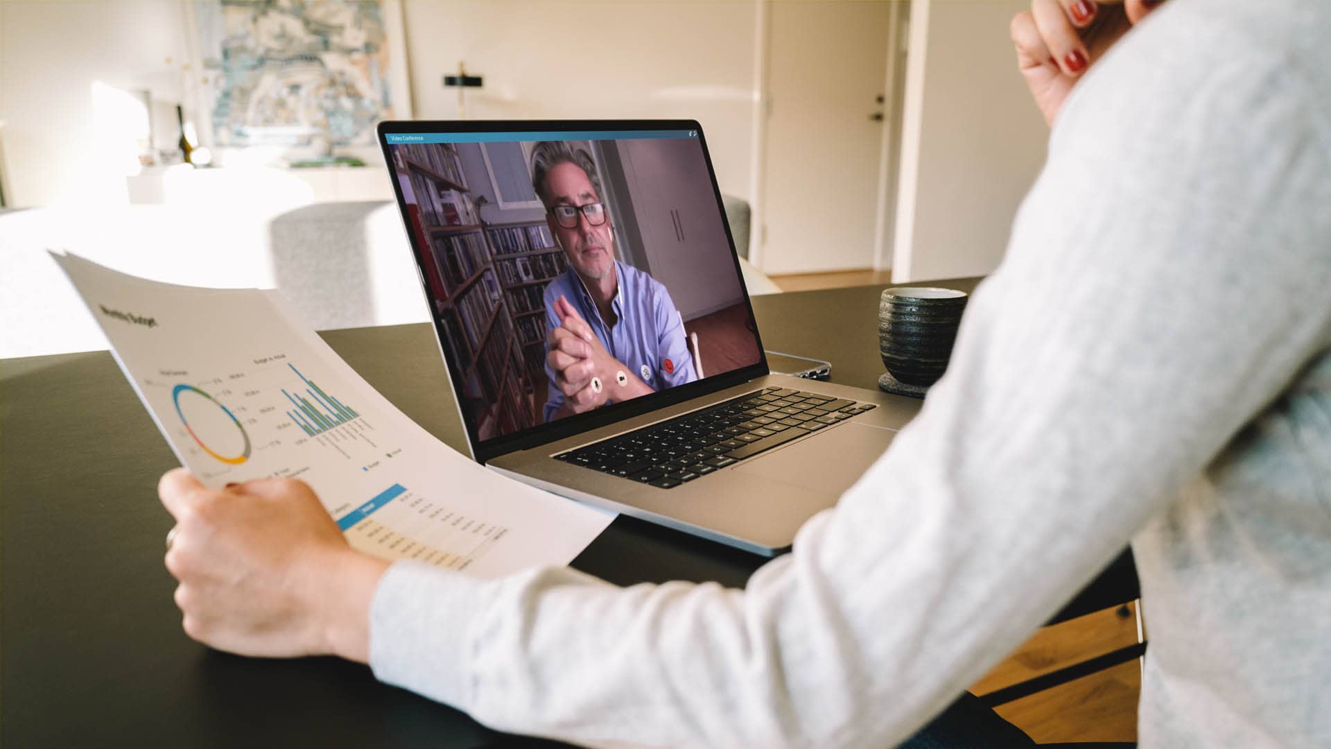 a man looking at data and discussing in a meeting